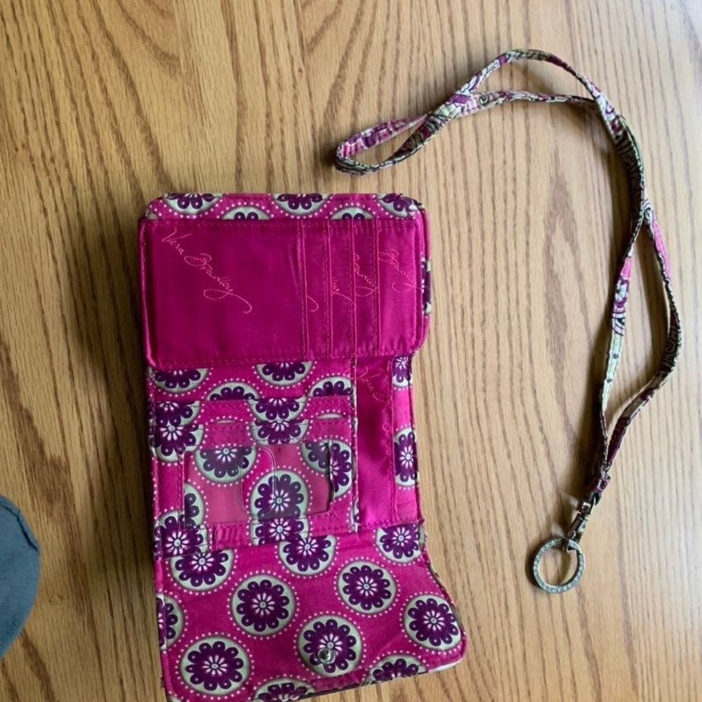 Selling Vera Bradley euro wallet and lanyard pattern is very paisley.